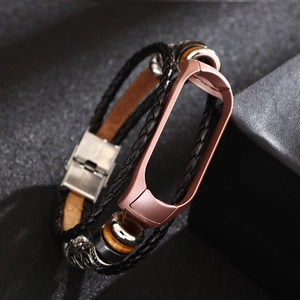 Detail of retro leather strap with rose gold metal frame for smart band and beads