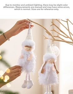 Detail of plush Christmas angel doll with sequin hat hanging on a decorative branch