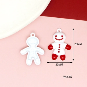 White gingerbread man alloy charm with red details, dimensions 28mm by 20mm and 2.4g weight