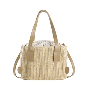 Minimalist beige woven straw tote bag with PU leather straps and a drawstring closure