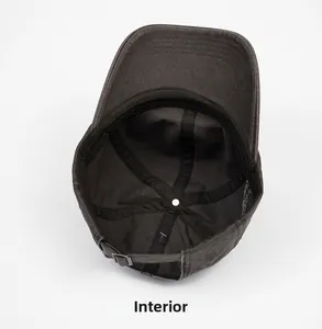 Internal view of a washed cotton baseball cap featuring sweatband and six-panel stitching