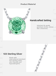 Macro detail of S925 silver necklace with sparkling green rose-cut zirconia pendant