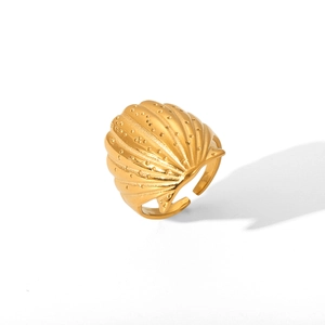 Detailed view of adjustable golden shell ring in polished stainless steel