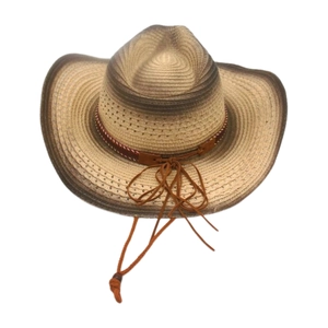 Detail of bohemian straw cowboy hat featuring gradient brim and breathable woven eyelets