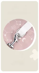 Detail of pink celestial dog coat showing reinforced metal D-ring for leash attachment
