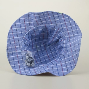 Internal view of blue plaid sun hat featuring breathable lining and windproof drawstring