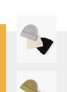 Detailed close-up of colorful thick knit beanies showing soft wool texture and rolled edges