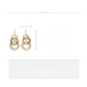 Detail showing dimensions and material of hollow geometric gold drop earrings