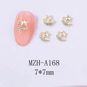 Detailed 7x7mm gold star and moon nail art charms with crystals on a white background