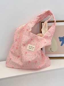 Pink quilted tote bag with cute rabbit and flower patterns and woven label
