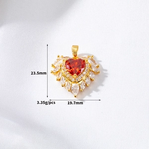 Detail of red heart zircon pendant with gold finish and measurement dimensions