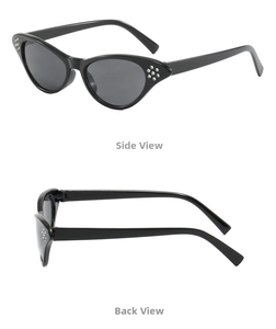 Detail view of black cat-eye glasses with silver rhinestones on side and back frames