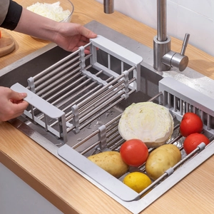 Extendable stainless steel sink rack with gray frame for drying fruits and vegetables