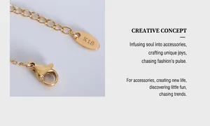 Macro shot of 18k gold plated lobster clasp and K18 engraved tag on baroque pearl necklace