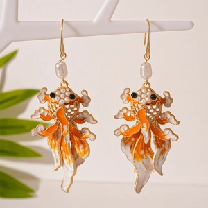 New Chinese style koi fish earrings with enamel finish and baroque pearls on white stand