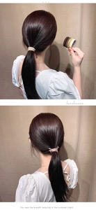 Detail of high-elastic braided hair ties in warm beige and brown tones for women