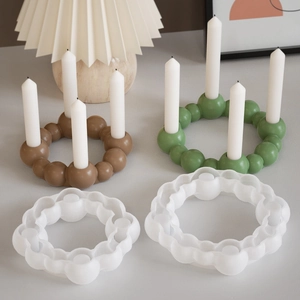 Macro view of silicone candle holder mold with finished beaded ring resin crafts