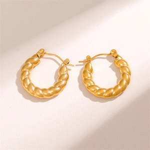 Minimalist twisted golden stainless steel hoop earrings with elegant woven texture design