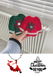 Detail view of handmade Christmas mini sweater felt ornaments in red and green colors