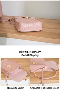 Close-up of pink crocodile pattern PU leather phone bag with golden twist lock