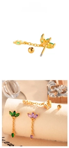 Detailed view of colorful zircon tassel crown stud earrings with green and purple stones
