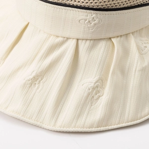 Beige hollow sun hat with star embroidery and breathable mesh texture detail