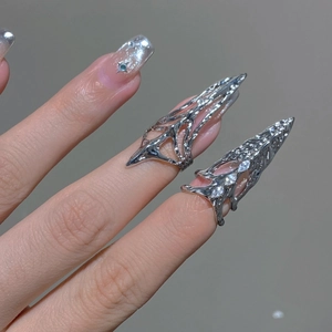 Silver liquid metal style geometric nail rings with zircons on model's fingers