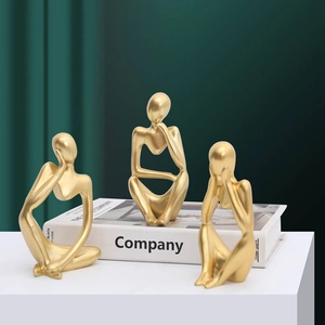 Set of three golden abstract thinker sculptures for modern minimalist home desk decor