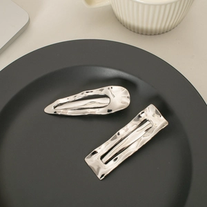 Silver geometric metal hair clips with hammered texture for a minimalist look