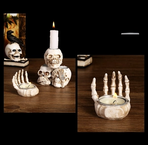 Detailed view of gothic resin skull hand candle holder with antique bone texture
