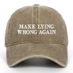 Detail of white embroidery Make Lying Wrong Again on washed khaki cotton baseball cap