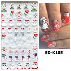 Macro detail of 5D Christmas nail stickers with Santa Claus and snowflake relief patterns