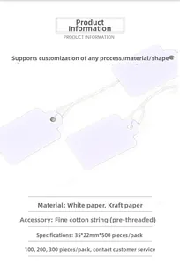 Close-up of 35x22mm white blank jewelry price tags with pre-tied cotton strings
