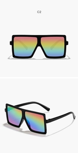 Detail view of square oversized kids sunglasses with rainbow lenses and black frames