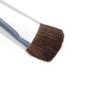 Macro shot of soft horse hair eyeshadow brush with a polished silver metal ferrule