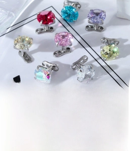 Macro shot of 6mm zircon dermal anchors with G23 titanium base in various colors