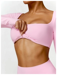 Detail of pink square neck yoga top featuring double-layer stretch athletic fabric