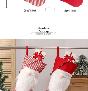 Detailed view of red Christmas gnome stockings with striped cuffs and plush white beards