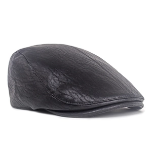 Detailed view of black faux leather beret featuring premium litchi texture and fine stitching
