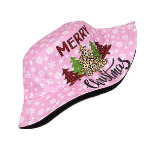 Detailed view of pink Christmas bucket hat with Merry Christmas print and snowflakes