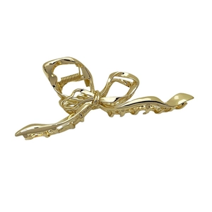 Elegant gold metal bow hair claw clip for women featuring high-gloss polished finish