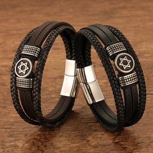 Men's multi-layer leather bracelets with stainless steel Star of David on wood background