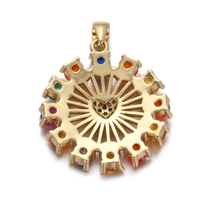 Detail of gold compass pendant with rainbow zircons and a central heart cutout
