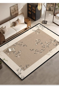 Modern art rug with floral vine pattern and black edges in a cozy living room setting