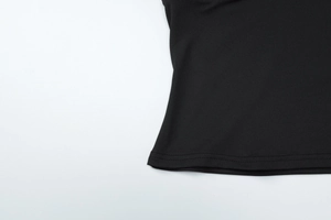 Detailed close-up showing the double-needle stitching on the black flared pants set hem