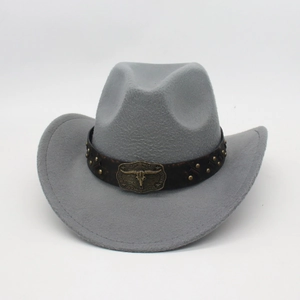 Detail of grey western cowboy hat with brown leather band and bronze bull skull buckle