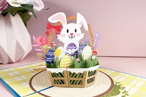 3D pop-up Easter card featuring a white bunny with a flower basket and colorful eggs
