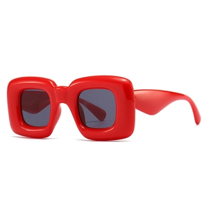 Futuristic red chunky square frame sunglasses with dark grey lenses for modern style
