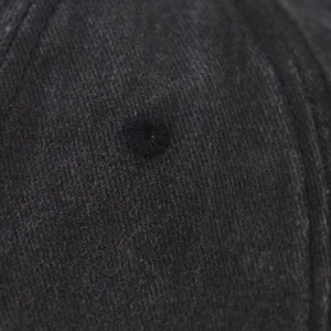 Macro detail of high-quality cotton twill fabric and embroidered eyelet on baseball cap