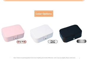 Three small portable PU leather jewelry boxes in pink, white, and black with snap closures
